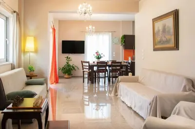 a living room with a couch and a dining room at Kadiani's Residence by 8essentially in Chania Town