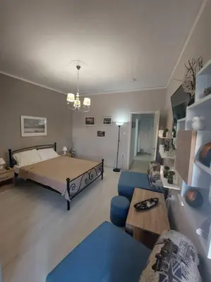 a living room with a bed and a couch at Koum Kapi 1st floor apt in Chania Town