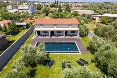 an aerial view of a house with a swimming pool at Eightyfour Living with private pool in Chania Town