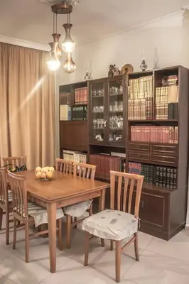 a dining room with a wooden table and chairs at Nelly's House in Chania Town