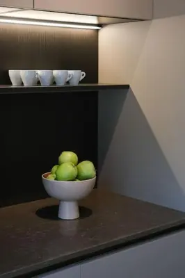 a bowl of green apples sitting on a counter at In Heart of Old Town Saint Rocco's Chic Apt in Chania Town