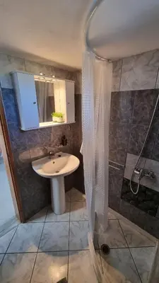 a bathroom with a sink and a shower at Casa Artemis in Plátanos