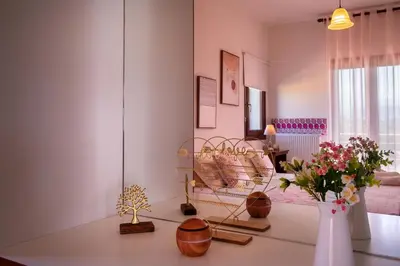 a living room with a table with vases on it at Al Aker Villa with private pool in Kalathas