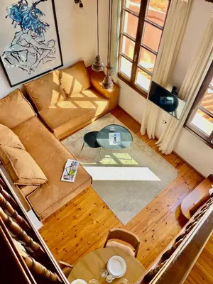 an overhead view of a living room with a couch and a table at Erietta Suites in Chania Town