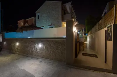 a villa with a swimming pool at night at Villa Constancia in Stalos