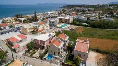 an aerial view of a small town next to the ocean at Villa Constancia in Stalos