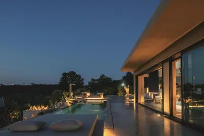 a house with a swimming pool at night at Inspiration House in Souda