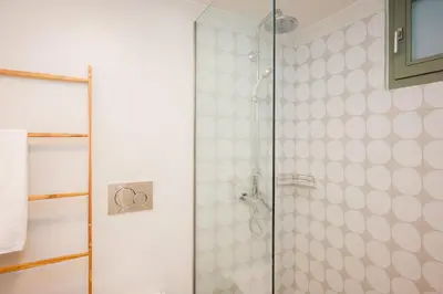 a shower with a glass door in a bathroom at Villa Kalliopi in Chania Town