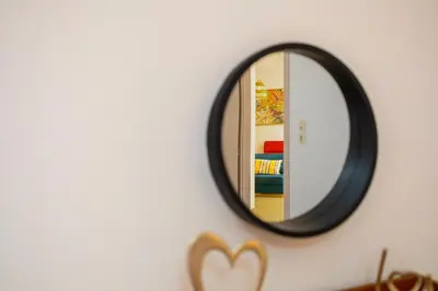 a mirror on a wall next to a room at Lazareta 3 in Chania Town