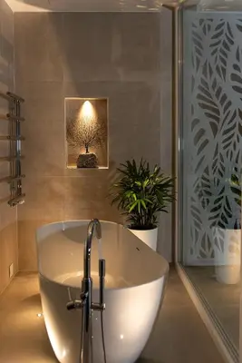 a bath tub in a bathroom with a picture of a tree at Villa Inati in Nípos