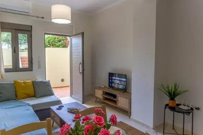 a living room with a couch and a table at Dictamus apartment in Chania Town