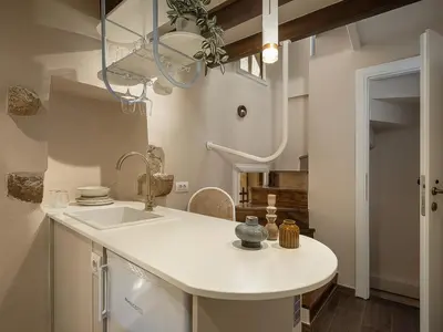 a kitchen with a white counter and a sink at Artemide city places _Leon tiny suite in Chania Town