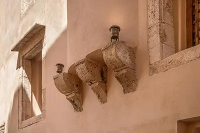 a pair of shoes on the side of a building at Artemide city places _Leon tiny suite in Chania Town