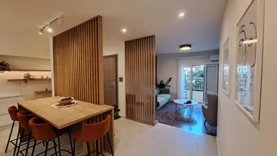 a kitchen and dining room with a table and chairs at Downtown Delight in Chania Town