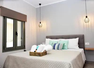 a bedroom with a bed with a basket on it at Olgas cozy home in Chania Town