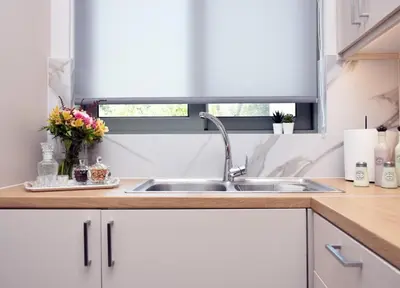 a kitchen with a sink and a window at Olgas cozy home in Chania Town
