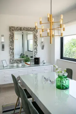 a dining room with a table and a mirror at Mediterranean villa Seaview privet pool in Tersanas
