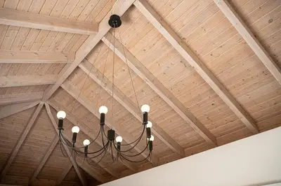 a chandelier hanging from a wooden ceiling at Mediterranean villa Seaview privet pool in Tersanas