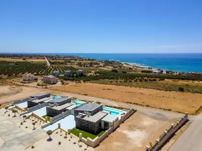 an aerial view of a resort and the ocean at FYSIOPHYLIA VILLAS in Frangokastello
