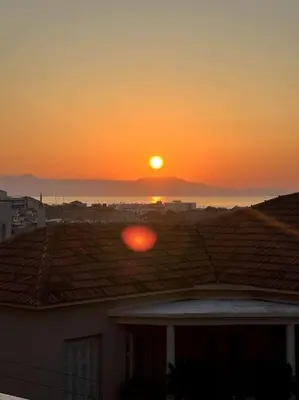 a sunset from the roof of a house at ZEN central flat with seaview by 8essentially in Chania Town