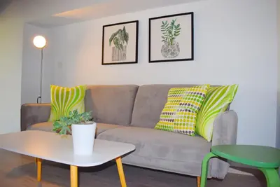 a living room with a couch and a table at Renia's house in Daratso