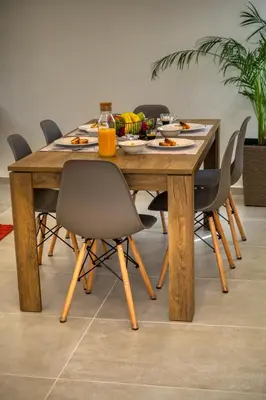 a wooden table with chairs and food on it at Callisto House in Kalyves in Kalyves