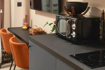 a microwave sitting on top of a kitchen counter at D-Loft Chania in Chania Town