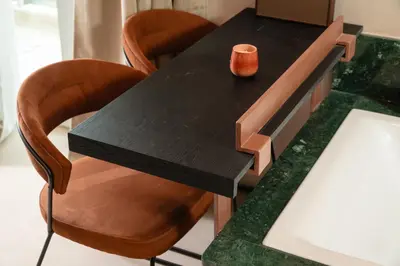a table with chairs and a vase on top of it at D-Loft Chania in Chania Town