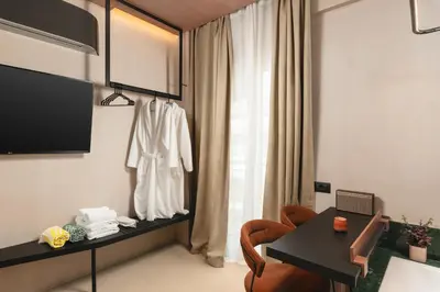 a room with a table and a chair and a window at D-Loft Chania in Chania Town