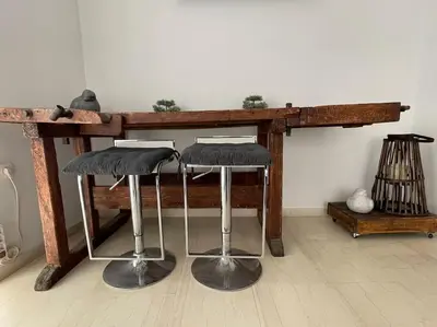 a wooden table with two bar stools under it at Enjoy Chania in Chania Town