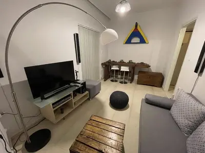 a living room with a couch and a tv at Enjoy Chania in Chania Town