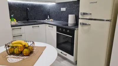 a kitchen with a basket of bananas on a table at Cozy Studio in the Heart of Chania in Chania Town