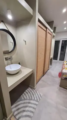 a bathroom with a sink and a mirror at Cozy Studio in the Heart of Chania in Chania Town