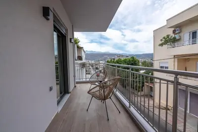 a balcony with a chair and a view at MAGNOLIA Luxury Chania Central Apartments in Chania Town