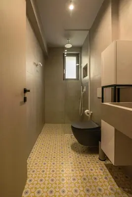 a bathroom with a tub and a toilet and a sink at MAGNOLIA Luxury Chania Central Apartments in Chania Town
