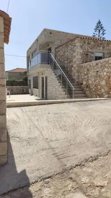 a building with a staircase in front of it at Ioanna Apartment 1 in Chania Town