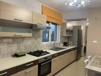 a kitchen with a sink and a stove top oven at Anastasia’s Home in Chania Town