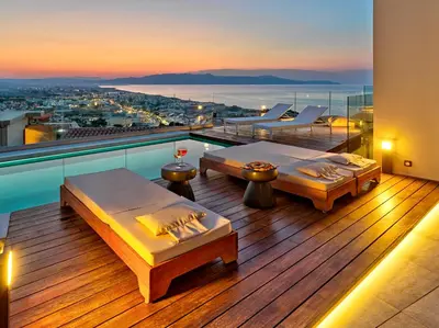 a room with two beds on a balcony with a view at Alectrona Living Crete, Apartment Olīvea in Plataniás