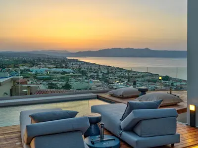 a living room with a view of the ocean at Alectrona Living Crete, Apartment Olīvea in Plataniás