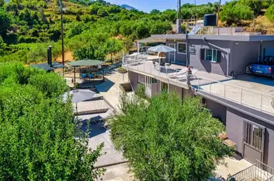 an overhead view of a building with trees in front at Karel house in Karés