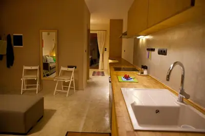 a kitchen with a sink and a counter top at Horizonte Seafront Suites in Kissamos