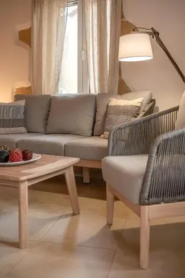 a living room with a couch and a table at Elma's Villa in Kissamos