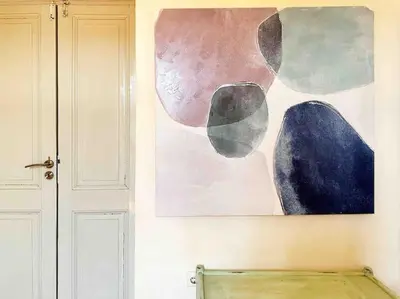 a painting hanging on a wall next to a door at Villa Xanthippe in Vamos