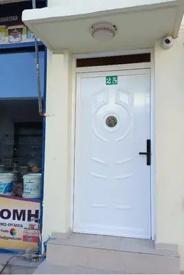 a white door with a sign on it in a store at The blackbird's nest in Chania Town
