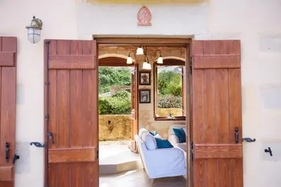 an open door into a living room with a couch at Patriko Villa in Kissamos