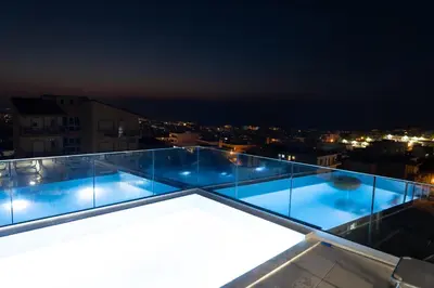 a view from the roof of a building at night at EDEL Suite in Chania Town