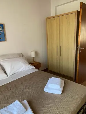 a bedroom with a bed with two towels on it at Stelios house in Chania Town