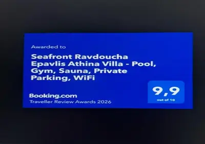 a screenshot of a cell phone with a blue screen at Seafront Ravdoucha Epavlis Athina Villa - Pool, Gym, Sauna, Private Parking, WiFi in Ravdhoúkha
