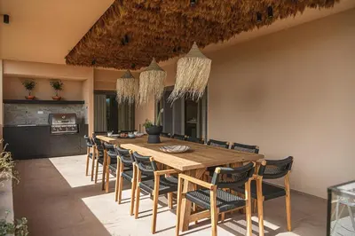 a dining room with a wooden table and chairs at Villa Agali I 