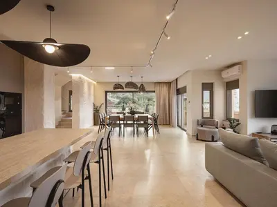 a dining room and living room with a table and chairs at Villa Agali I 